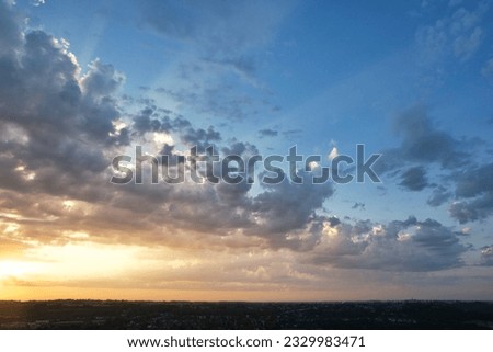 High Angle View of Luton City of England During Sunrise with Dramatical Clouds over Blue Sky. Image Was Captured with Drone's Camera on July 8th, 2023