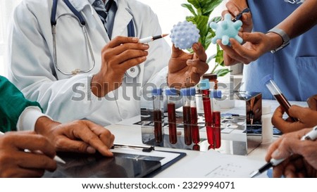 Businessman shaking hands with doctor in conference room Doctor and pharmacist shaking hands in medical office Salesman with new medicines shaking hands in hospital with medical team