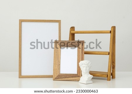 Photo frames with blanks on the table on a white background