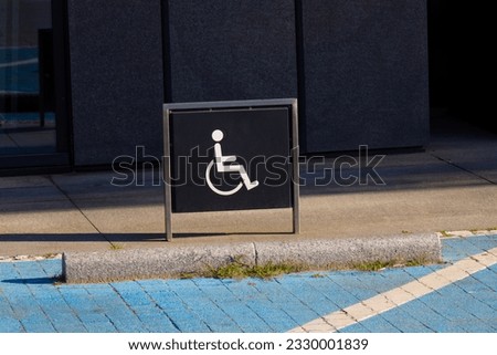 Handicap sign on black board. This is parking lot for reserve for person who use wheelchair.