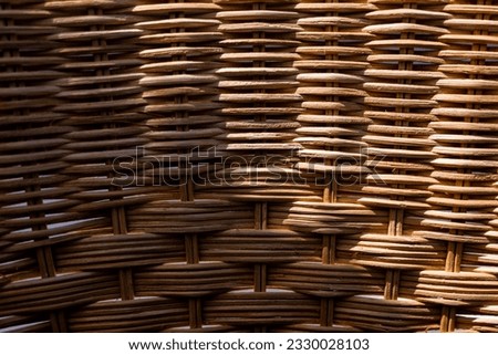 Wicker texture on back of patio lounge chair
