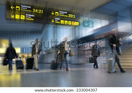 Airline Passengers in an International Airport Royalty-Free Stock Photo #233004307