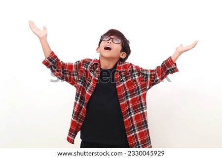 Wow surprised face expression of asian boy standing while looking above like receiving something Royalty-Free Stock Photo #2330045929
