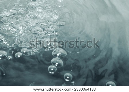 The gray water surface looks bright and fresh with lots of air bubbles floating around, perfect for illustrations and backgrounds.