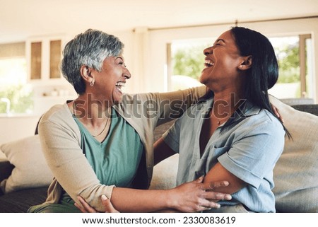 Funny, senior mother and hug daughter in home, bonding and laughing together. Happy, elderly mom and embrace woman, relax and smile with care, love and enjoying time on living room sofa with family. Royalty-Free Stock Photo #2330083619