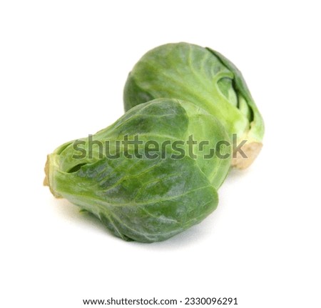 Apile of Brussels sprouts on a white background Royalty-Free Stock Photo #2330096291
