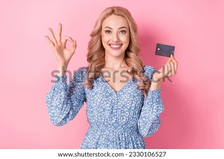 Photo of funny young charming lady blonde hair okey sign hold plastic card deal business works salary isolated on pink color background