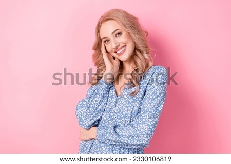 Portrait of young curly blonde girlfriend charming touch cheek posing preppy gorgeous white teeth smile isolated on pink color background