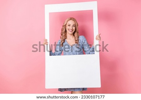 Photo of stunning nice person toothy smile good mood hands hold paper album set card isolated on pink color background