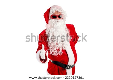 santa claus in red suit with beard in glasses shows handshakes and welcomes on white isolated background, the concept of new year and christmas and deal