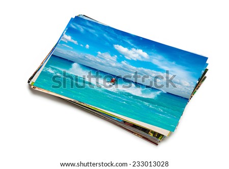 Holidays beach adventure concept creative background - stack of vacation photos with man riding jet ski image on top isolated on white background