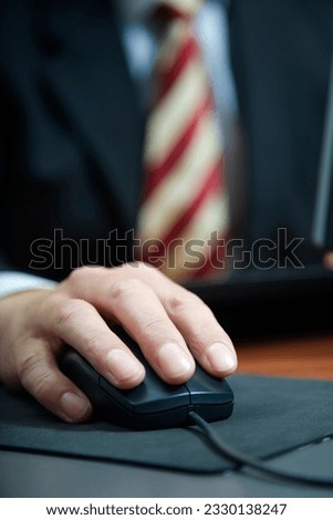 people at work- close-up of a businessman using a mouse