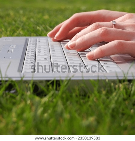 A young women working on a laptop.