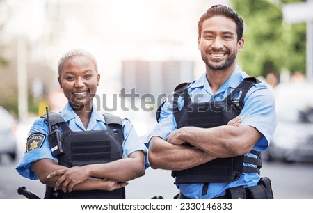 Happy, portrait and police with arms crossed in the city for security, safety and justice on the street. Team, pride and a black woman and a man with confidence working in urban crime together Royalty-Free Stock Photo #2330146833