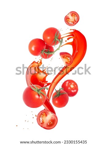 Ripe tomatoes in splashes of juice isolated on white background