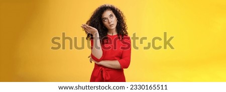 Girl being annoyed unwilling to listen boyfriend yell rolling eyes up from annoyance and irritation sighing bothered slapping forehead with palm fed up and disappointed over yellow background Royalty-Free Stock Photo #2330165511