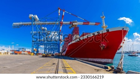 Shipping containers being unloaded at port facilities in Ashdod, Israel, Containers ships Loading In Ashdod Ports. Israel   Royalty-Free Stock Photo #2330166219