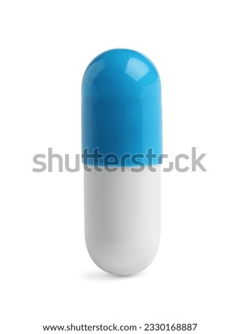 One pill on white background. Medicinal treatment Royalty-Free Stock Photo #2330168887