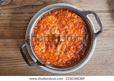 Turkish Menemen omelet in a frying pan. . Royalty-Free Stock Photo #2330188389