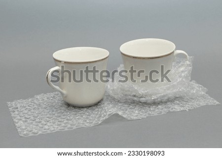 white porcelain wrapped with bubble wrap.