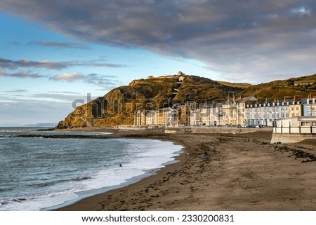 The North Beach and Seafront with its colourful buildings at Aberystwyth, West Wales. Royalty-Free Stock Photo #2330200831