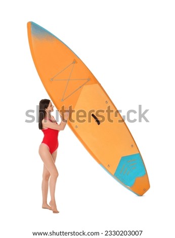 Happy woman with orange SUP board on white background