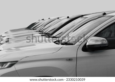 white SUV cars standing in a row. Fleet of generic modern cars. Transportation. Luxury OFFROAD car fleet consisting of generic brandless design. isolated in WHITE background.  Royalty-Free Stock Photo #2330210039