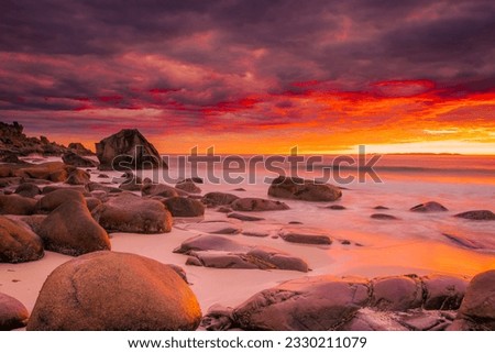Dramatic midnight sunset with amazing colors over Uttakleiv beach on Lofoten Islands, Norway Royalty-Free Stock Photo #2330211079