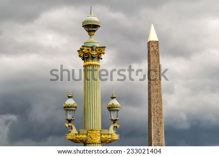 Obelisk in Place de la Concorde against cloudy sky - Paris.