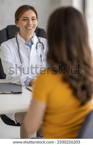 Young woman visiting doctor in clinic.People,healt care and medical concept. Royalty-Free Stock Photo #2330226203