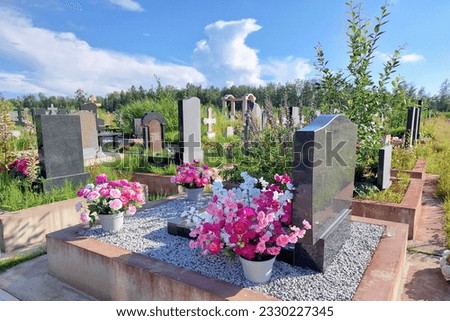 Orthodox cemetery. Graves with crosses, tombstones. Clear sunny weather. High quality photo