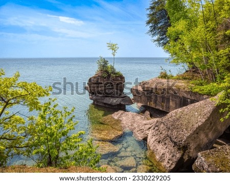 Rocky coastline of Lake Superior in Big Bay State Park in La Pointe on Madeline Island in the Apostle Islands National Lakeshore in Wisconsin USA Royalty-Free Stock Photo #2330229205