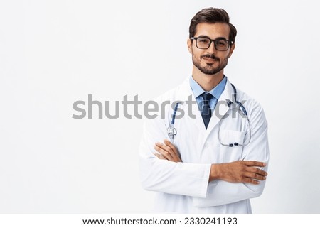 Man portrait of a doctor wearing a white coat and eyeglasses and a stethoscope looking into the camera on a white isolated background, copy space, space for text, health Royalty-Free Stock Photo #2330241193