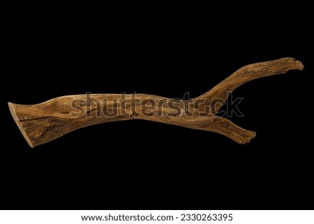 Piece of well-worn driftwood isolated on black background with clipping path