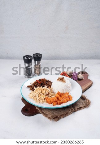 Nasi Rames, Nasi Uduk, Nasi Warteg, Tempe Orek, Kentang Balado, Ayam Suir, Ayam Suwir, Indonesian Food, Food Photography Royalty-Free Stock Photo #2330266265