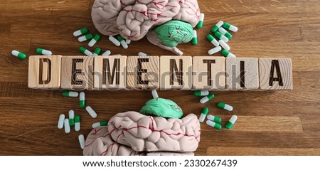 Use of nootropics to improve memory and nerve function and dementia. Idea of smart drugs and cognitive enhancers with brain and pills Royalty-Free Stock Photo #2330267439