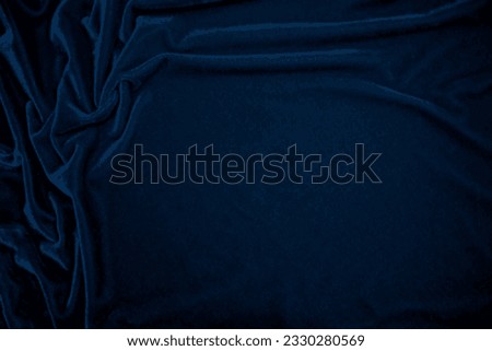 Dark blue velvet fabric texture used as background. Peacock color panne fabric background of soft and smooth textile material. crushed velvet .luxury navy tone for silk.