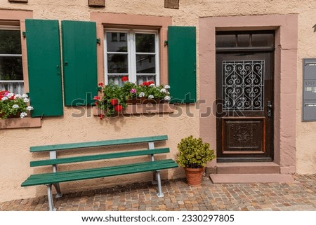 Bench and an old house in Schiltach village, Baden-Wurttemberg state, Germany Royalty-Free Stock Photo #2330297805