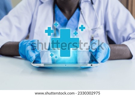 African American man doctor with medical icons on tablet analysis technology equipment medicine healthy, Medical doctor technology and healthcare concept.