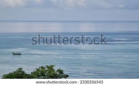 fishing boat in the blue sea ocean 