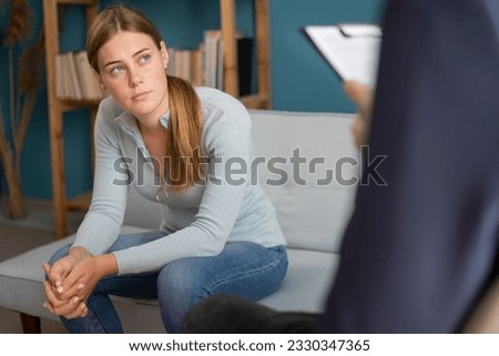 Psychologist working with a teenager in his office. Psychotherapy session with professional psychologist. Copy space Royalty-Free Stock Photo #2330347365