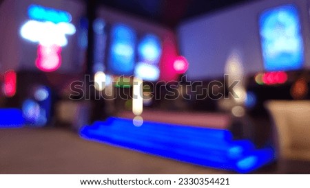 Blur focus of Movie theater entrance interior blur image use for background of business and cinema concept. Abstract blurred image of lobby of movie theater