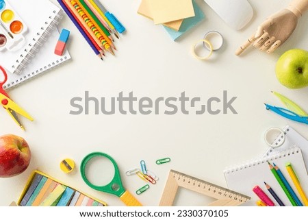Embark on a successful educational journey with this creative top-down photograph of meticulously arranged school supplies on white background. Use empty space to include text or advertisements