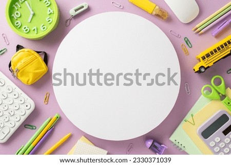 Embrace the convenience of online learning with this top-down photo featuring a keyboard, mouse, planner, pens and stationery on a violet background. Ample round frame available for text or ads