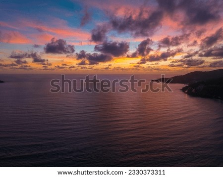 Drones take pictures of the beautiful sky by the beach in stunning sunset.
colorful sky in sunset above Patong city at twilight. 
Scene of romantic sky sunset background.