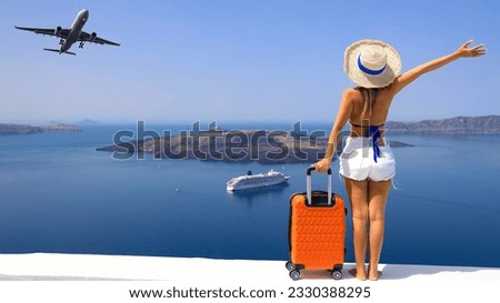 Happy moment with young woman tourist as orange the luggage in Santorini island,Greece-Travel caoncept