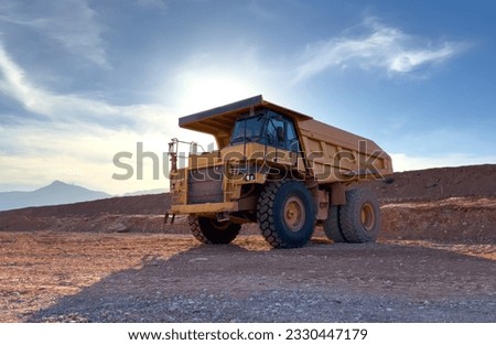 Mining truck in open-pit mining. Construction equipment on soil transport. Haul truck at construction site. Mining civil works and Earthmoving. Off highway Trucks on construction. Haul dump truck. Royalty-Free Stock Photo #2330447179