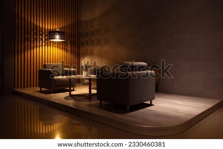 Armchairs and coffee table in classic black interior. Royalty-Free Stock Photo #2330460381
