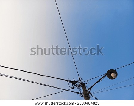 wires and lights against a clear sky background
