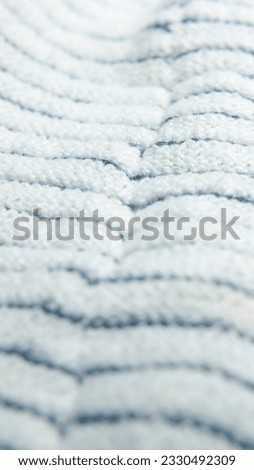 Seams in black and white stripes fabric